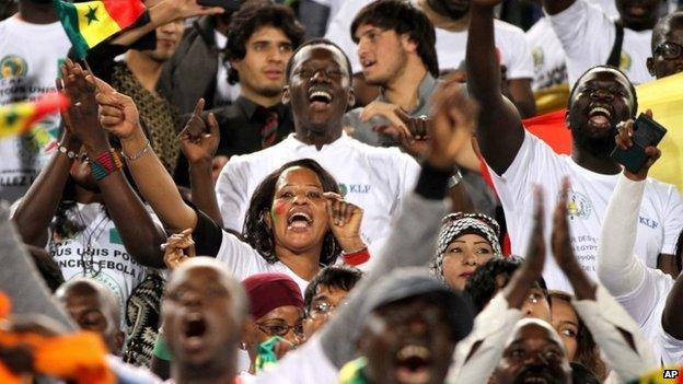 Senegal fans cheer for their national team during their African Cup of Nations group G qualifying soccer match at Cairo International Stadium in Cairo, Egypt on 15 November 2014