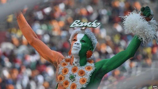 An Ivorian fan gestures at the Felix Houphouet-Boigny Stadium in Abidjan on 19 November 2014