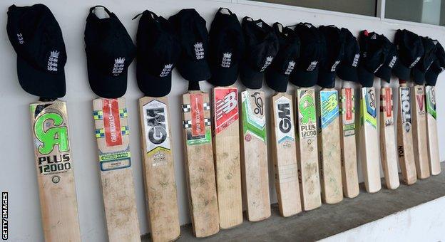 England bats in a row outside their dressing room