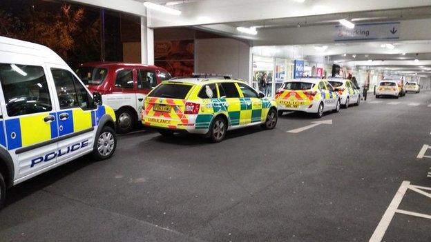 Police and ambulance vehicles outside a Tesco store