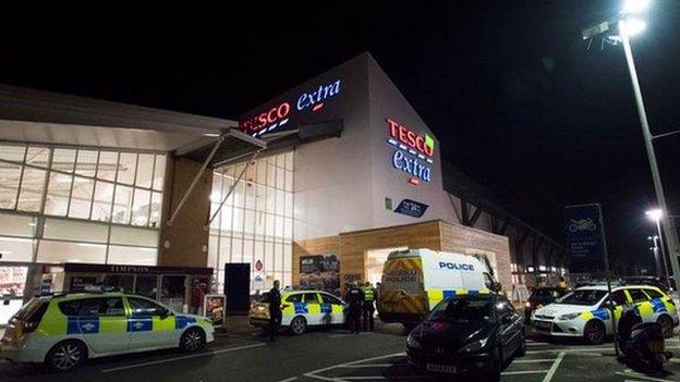 Police units outside the Cardiff store