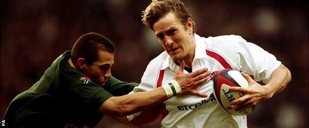 England's Will Greenwood takes on South Africa's Conrad Jantjes