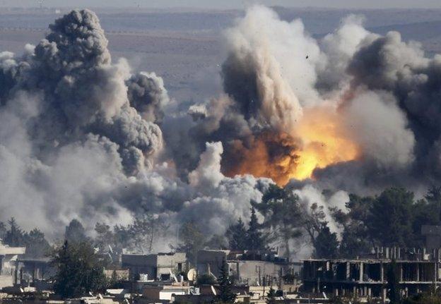 Smoke rises over Syrian town of Kobane after an air strike, as seen from the Mursitpinar border crossing on the Turkish-Syrian border in the town of Suruc in this file October 18, 2014 file photo