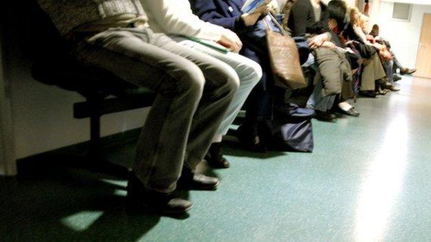 Patients queuing to be seen in hospital