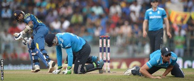 Sri Lanka's Mahela Jayawardene hits the ball past England's Alastair Cook