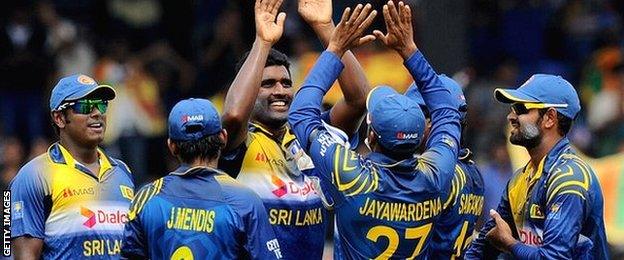 Sri Lanka celebrate a wicket by Thisara Perera (centre)