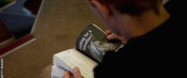 Studying the pedigrees at the Tattersalls sale