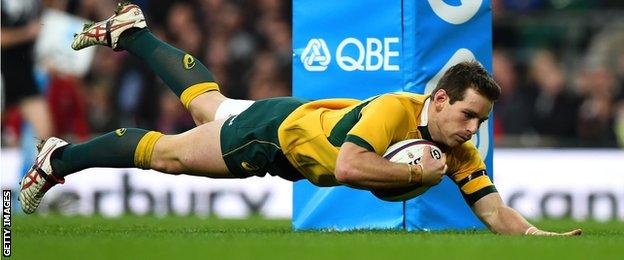 Bernard Foley dives over to score for Australia