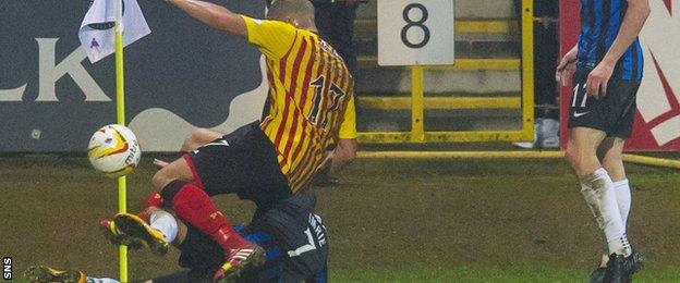 Jake Carroll is up-ended by Hamilton's Dougie Imrie, who was sent off for the challenge