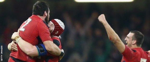 Scott Baldwin and Jake Ball celebrate Wales' win, as does Sam Warburton