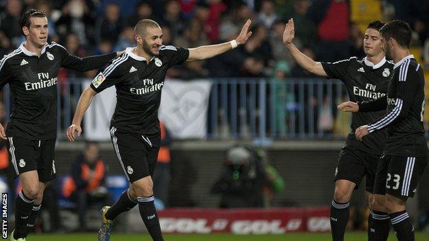 Real Madrid striker Karim Benzema celebrates his goal against Malaga