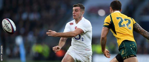 George Ford moves the ball on as Australia's Quade Cooper bears down