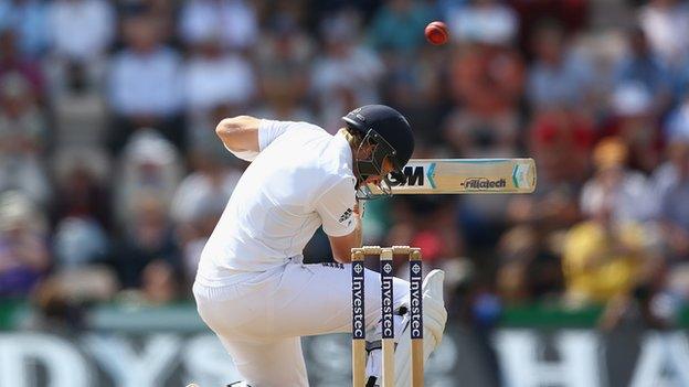 Joe Root ducks a bouncer