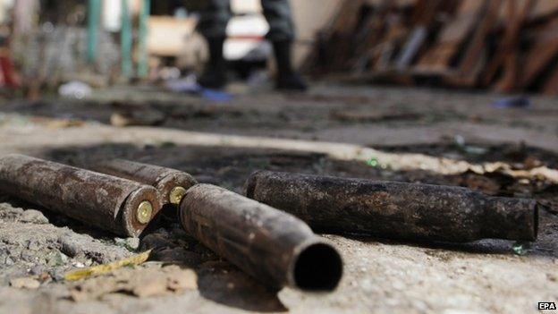 Empty bullets lying at the scene of an attack by the Taliban on the offices of a foreign aid organisation in Kabul (30 November 2014)