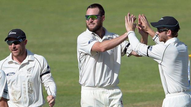 Mark Craig (centre) celebrates with Kane Williamson