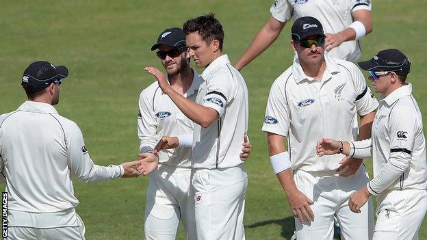 Trent Boult (centre) is congratulated