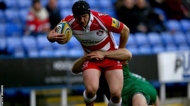 James Short of London Irish tackles Steve McColl of Gloucester