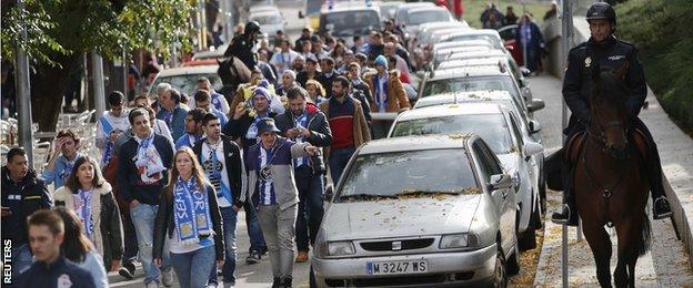 Deportivo supporters were escorted away from the Calderon Stadium following earlier clashes which ended with the death of a fan