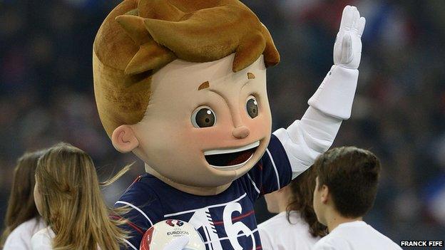 Super Victor waves to the crowd