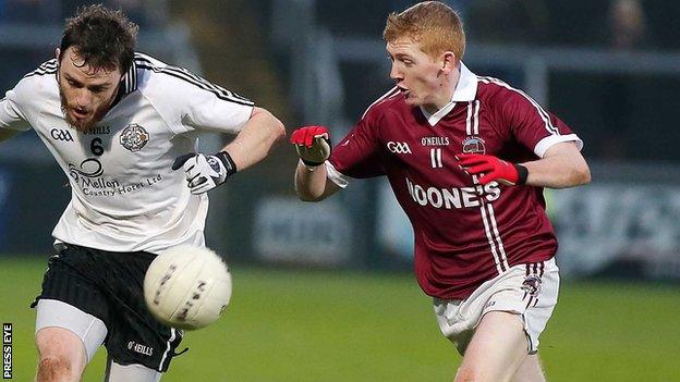 Barry Tierney of St Enda's in action against Slaughtneil's Christoper Bradley