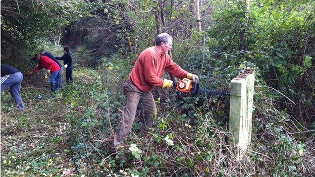 volunteers begin clearing St Agnes Church yard in Conwy