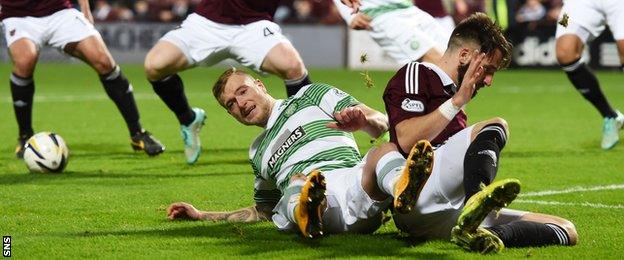 Brad McKay (right) pleads innocence after John Guidetti hits the deck to win a penalty.