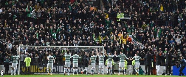 Celtic manager Ronny Deila leads his team over to celebrate at full-time in front of the travelling support.