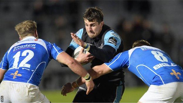 Peter Murchie is tackled by two Dragons players