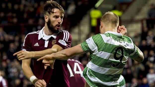 Hearts' Brad McKay (left) exchanges words with Celtic's John Guidetti after he won the visitors a penalty.