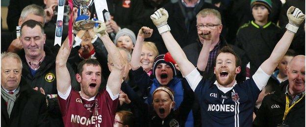 Slaughneil captain Francis McEldowney lifts the Seamus McFerran Cup after their narrow victory over Omagh