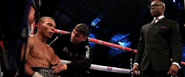 Chris Eubank Jr sits in his corner, over seen by his father Chris Eubank