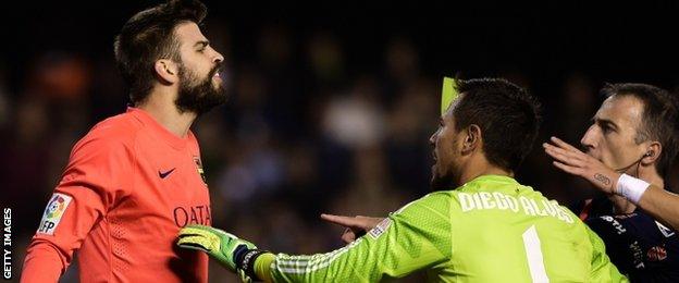 Barcelona defender Gerard Pique was booked following a first-half flare-up