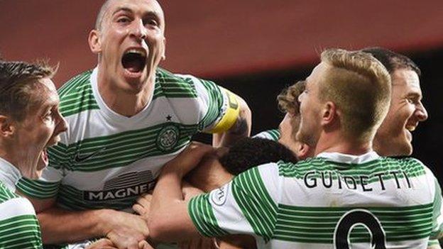 Celtic players celebrate Virgin Van Dijk's opening goal against Hearts