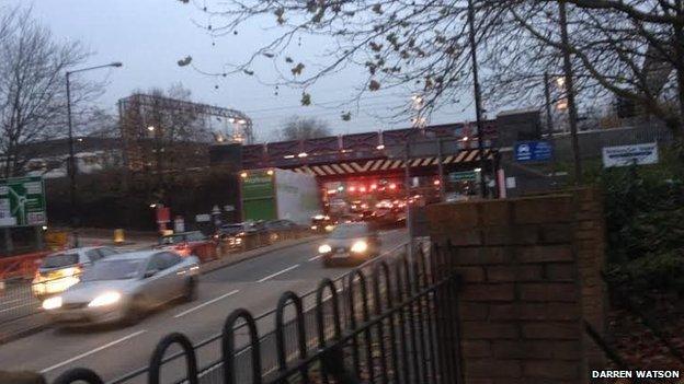 Lorry stuck under bridge