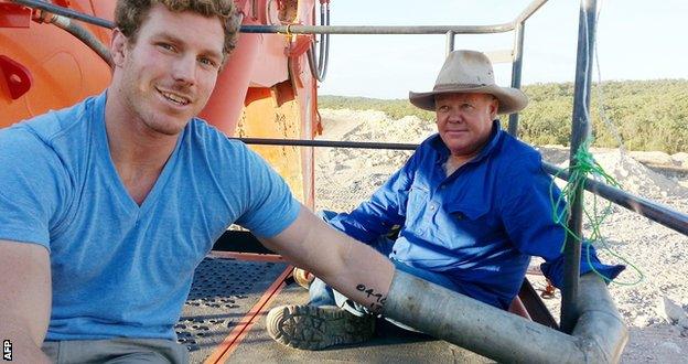 Pocock (left) chained himself to a digger at the Maules Creek mine along with local farmer Rick Laird