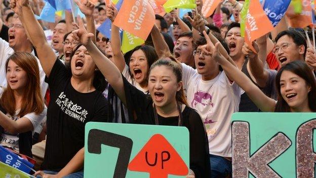 Supporters cheer on Taipei's new mayor-elect Ko Wen-je at his campaign headquarters in Taipei in Taiwan on 29 November 2014