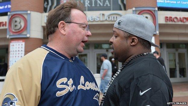 A protestor argues with a Rams fan outside the St Louis stadium on Sunday.