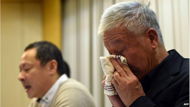 Pro-democracy activists Benny Tai (L) attends a press conference while Chu Yiu-ming (R) reacts in Hong Kong on 2 December 2014