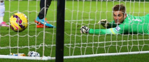 QPR goalkeeper Robert Green watches as Ki Sung-Yueng's goal is scored