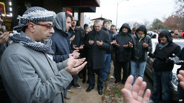 Bosnian protestors pray during a during demonstrations following the murder of Zemir Begic