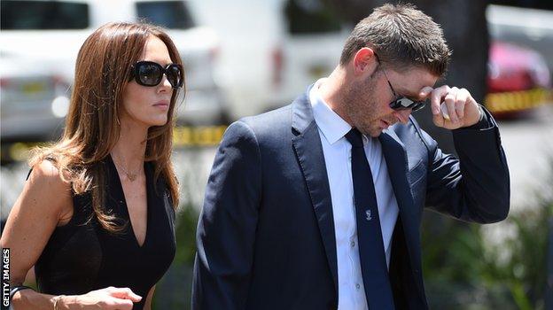 Australia captain Michael Clarke and wife Kyly arrive for the service