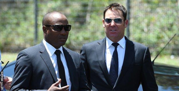 Brian Lara (left) and Shane Warne arrive for the service