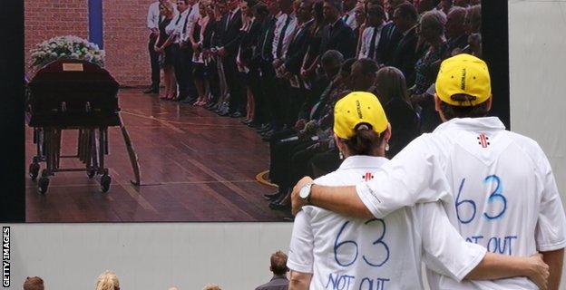 Couple watches funeral at SCG