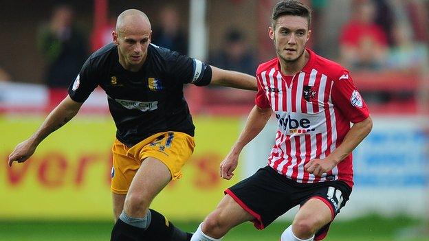 Adam Murray (left) in action against Exeter City this season