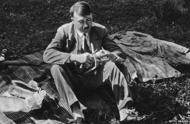 Hitler eating at a picnic