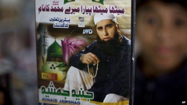 A vendor shows a DVD of Pakistan's Junaid Jamshed at a stall in Islamabad, Pakistan, Wednesday, Dec. 3, 2014.