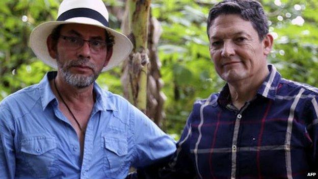 Handout picture released by the Farc guerrillas showing Farc commander Pastor Alape (left) and General Ruben Alzate after his released in Antioquia district, Colombia on 30 November 2014