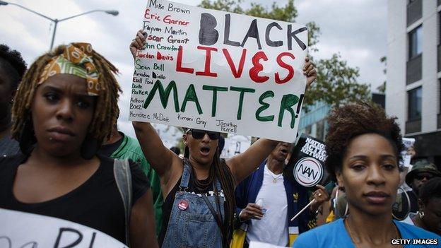 People marched during rally against police violence in New York on 23 August 2014