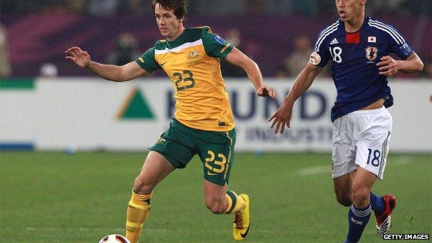 Robbie Kruse of Australia is chased by Keisuke Honda of Japan during the AFC Asian Cup Final match between the Australian Socceroos and Japan at Khalifa International Stadium on January 29, 2011