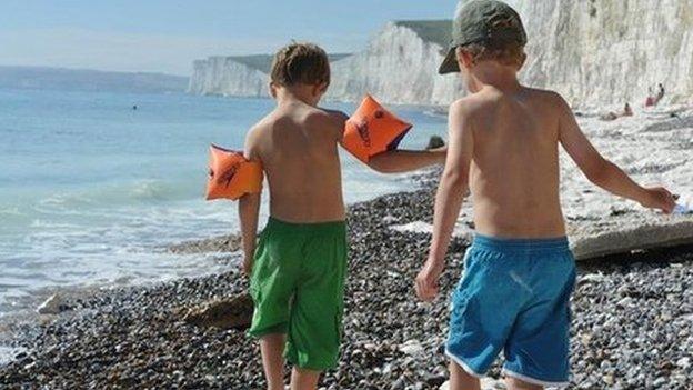 Two children playing on a beach